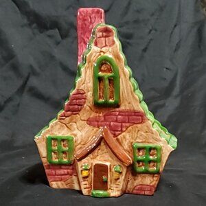 vintage ceramic wall pocket planter shaped like charming cottage house